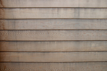 Red cedar cladding wood grain background, aged and weathered before renovation