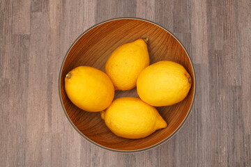 lemons in a wooden bowl