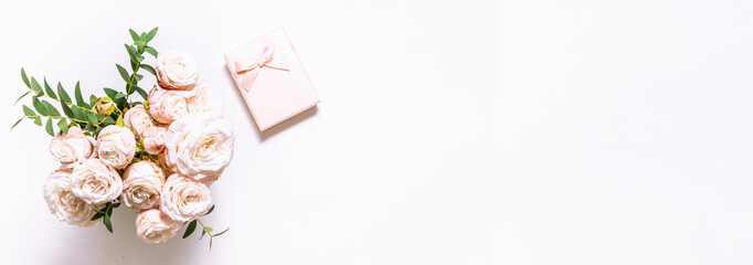 Minimalism style greeting card mock up with aromatic pink roses and gift box with bow on white...