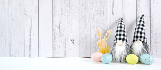 Happy Easter farmhouse theme banner styled with small wood bunny, eggs and buffalo plaid gnome...