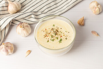 garlic sauce on a white table. Universal garlic sauce