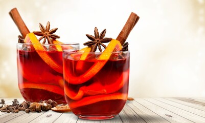 Apple cider with slices, cinnamon and anise stars in transparent cups. Seasonal apple mulled wine