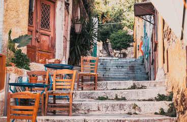 Fototapeta na wymiar restaurant tables on stairs in Athens Greece