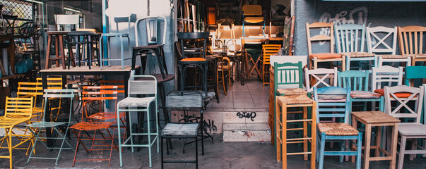 old colorful chairs in a second hand shop