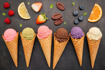 Flat lay ice cream cones collection on dark stone background . Blank crispy ice cream cone with copy space for sweets menu design. - 486381496