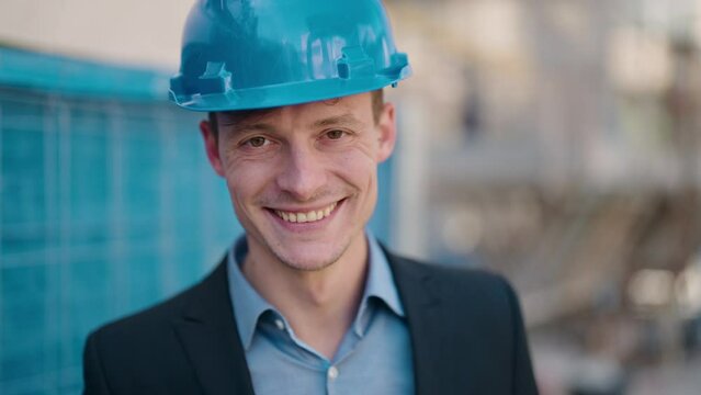 Young caucasian man architect smiling confident standing at street