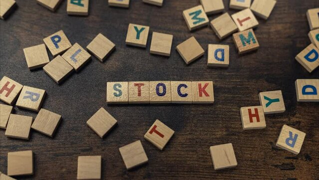 Stock word written from wooden block letters - zoom in shot. High quality 4k footage