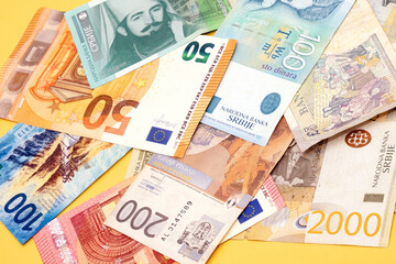 Pile of different currencies banknotes - obrazy, fototapety, plakaty