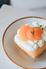 Orange cake and cream. Healthy Layered Orange Cake. Homemade bakery concept for birthday cake or valentine dessert.