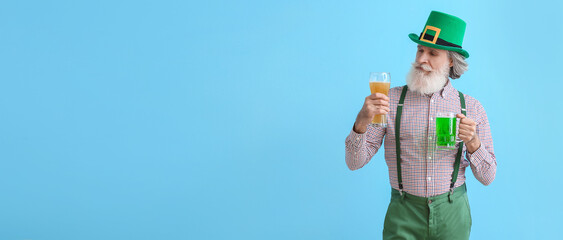 Senior man with glasses of beer on blue background. St. Patrick's Day celebration