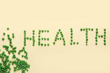 Word HEALTH made of green peas on beige background