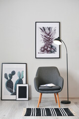 Stylish interior of minimalist room with armchair and floor lamp