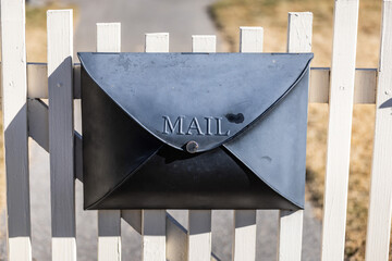 mail box on the white gate 