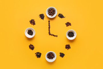 Clock made of bowls, coffee beans and dry tea leaves on color background