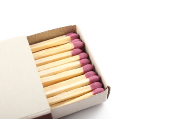 Opened matchbox with whole matches on white background, closeup