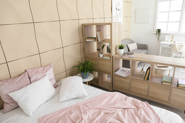 Wooden book shelf in interior of modern bedroom
