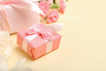 Beautiful gift box with bow on color background