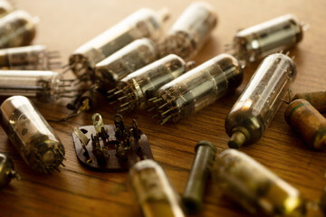 50's 60's Vacuum tube or valves on old wooden table.