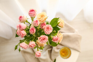 Fototapeta na wymiar Vase with roses in light room