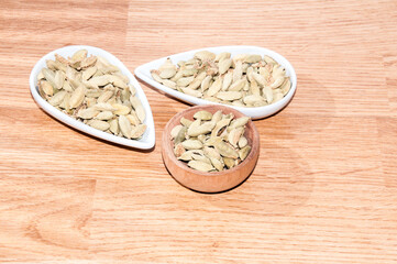 cardamom pods on the wooden background