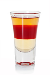 shot with layered cocktail on glass table
