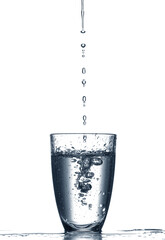 Pouring of clear water in glass isolated on white
