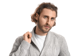 Fototapeta premium Handsome young man in knitted sweater on white background