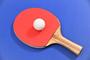 ping pong racket and ball