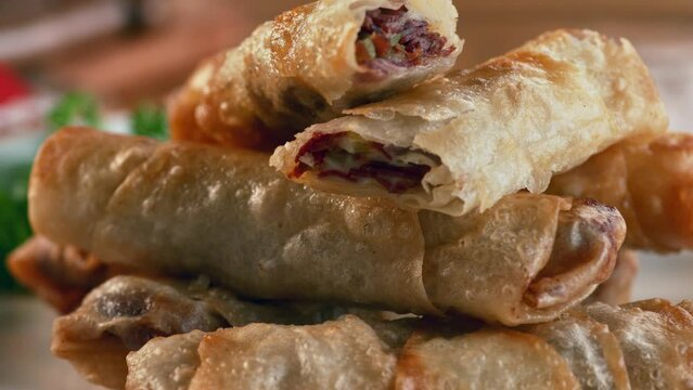 A traditional pastry on a serving plate.Delicious traditional Turkish pastry with pastrami. Macro, 4K, Phantom Camera, Super Close Up.