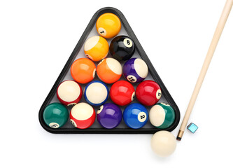 Billiard balls in triangle and cue on white background