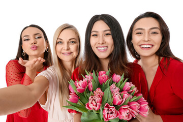 Beautiful women with flowers taking selfie on white background. International Women's Day celebration