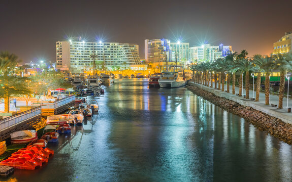 Night view on central marina from wolking promenade in Eilat – famous tourist resort and recreational city in Israel, concept of bliss and happy vacation