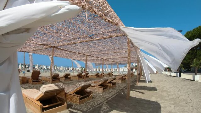 Tropical beach holiday and vacation concept. Empty sunbed VIP cabin canopy bed place for sun to retreat for privacy