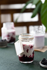 protein smoothie with black currant in a glass jar