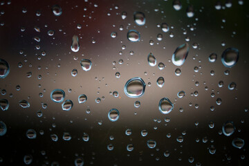 Water drops on glass showing unique patterns and reflections