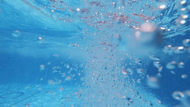 A nice view of underwater bubbles rising up to surface in slow motion