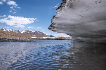 mountains river ice spring sky clouds