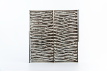 The used Carbon air filter of car air conditioner isolated on white background with clipping path