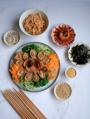 Chinese New Year must have dish. Seafood Yusheng aka Prosperity Toss with Abalone. Homemade Cantonese style 