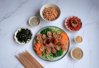 Chinese New Year must have dish. Seafood Yusheng aka Prosperity Toss with Abalone. Homemade Cantonese style 