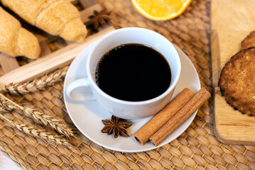 Fresh Black Arabica Coffee in a White Cup with Oatmeal Cookies and Bakery on Breakfast
