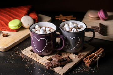 Obraz na płótnie Canvas Two Cups of Hot Chocolate with Marshmallows by the Dark Background. Horizontal View. Happy Valentine's Day! 