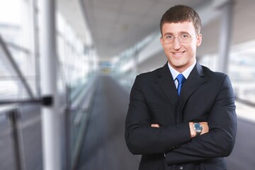 Fototapeta premium Confident handsome mature businessman professional standing in office posing