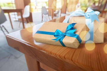 Colorful gift boxes with ribbon and bow on the desk