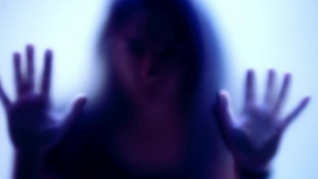 Trapped woman behind glass anxiety depression concept