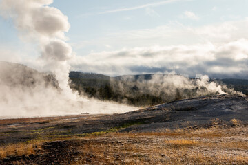 Landscape of hot zone with smoke in Yellowstone.