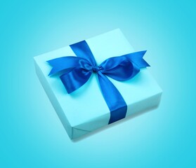 Luxury box tied with a ribbon on the desk.