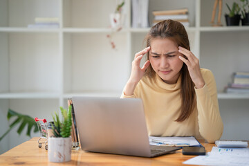 A stressed businesswoman is unsatisfied with her assignment, bored at work, and unhappy with her project.