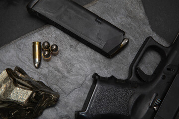 Gun violence and death concept with human skull and scattered bullets isolated on black background...