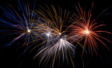 Festive colorful fireworks in the night sky